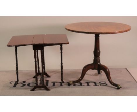 A George III and later mahogany circular tripod table (2)Turned column over downswept supports 82cm diameter; 74cm high and a