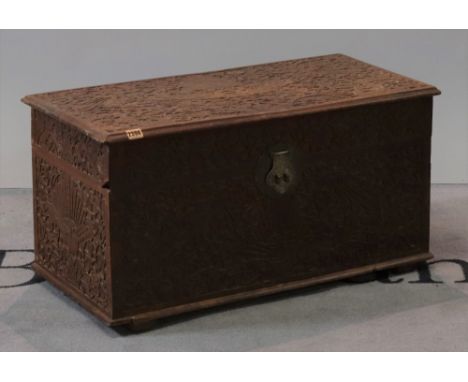 An early 20th century Anglo Indian hardwood trunkWith carved decoration 80cm wide; 42cm high
