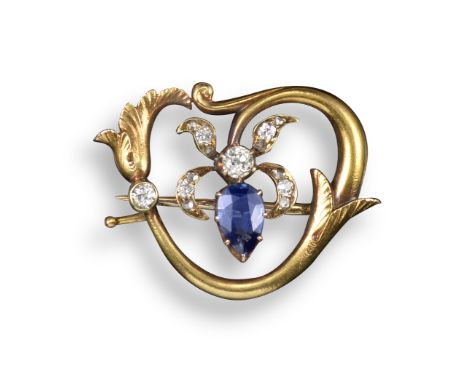 A sapphire and diamond-set Art Nouveau floral brooch by Fabergé, set with a pear-shaped sapphire and diamond-set flower head 