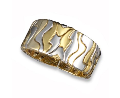 A yellow and white gold bangle, of abstract design, 5.3cm inner diameter, 108g