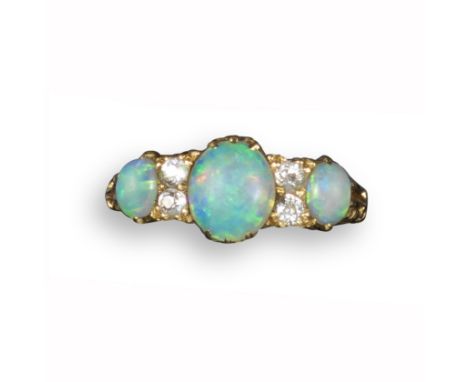 An opal and diamond seven-stone half-hoop ring, in yellow gold with scroll pierced shoulders, size N