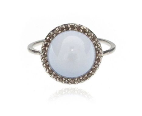 A sugarloaf-shaped chalcedony ring, set within a surround of rose-cut diamonds in white gold, size K