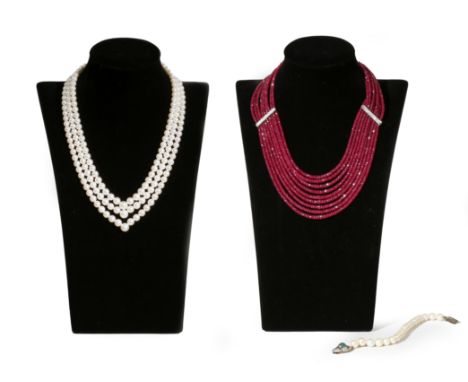 A nine-row ruby bead necklace, separated with diamond-set spacers with white gold clasp, 50cm longest, a graduated three row 