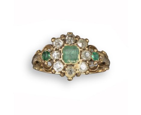 A late George III emerald and diamond cluster ring, set with three emeralds in closed-back mounts and a cluster of cushion-sh