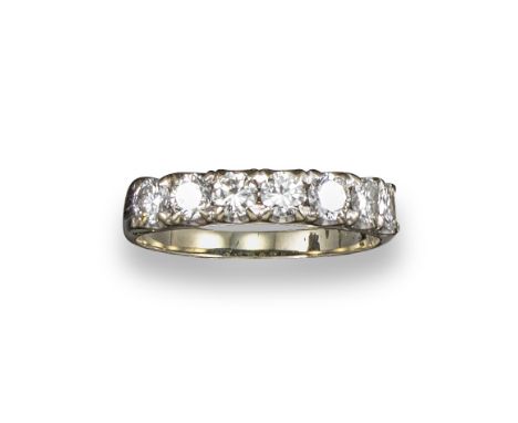 A diamond seven stone ring, set with circular brilliant-cut diamonds in yellow gold, size S