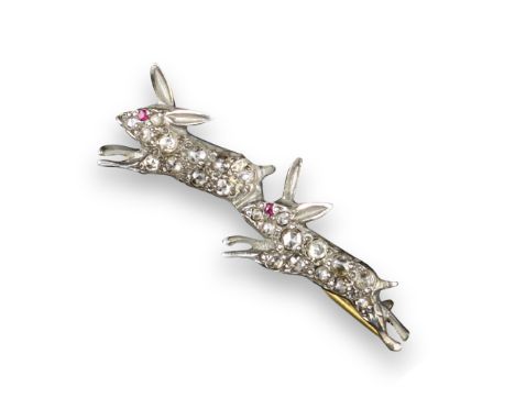 A ruby and diamond running rabbit brooch, each rabbit set with rose-cut diamonds and a ruby eye in silver and gold