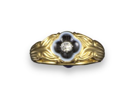 A Victorian yellow gold mourning ring, centred with a diamond on a quatrefoil agate mount, foliate carved shoulders with flut