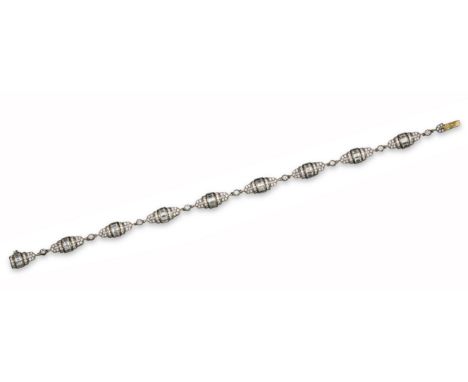 An Art Deco style bracelet, each link set with a central line of baguette-shaped diamonds within circular-cut pierced diamond