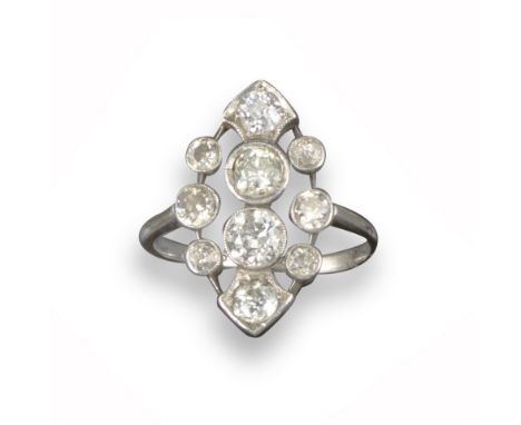 An Edwardian navette-shaped ring, pierced and millegrain-set with graduated old circular-cut diamonds in platinum and white g