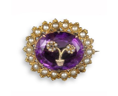 A 19th century amethyst and pearl brooch, the oval-shaped amethyst surmounted with a diamond giardinetto within border of pea