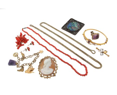 An amethyst and seed pearl-set gold bangle, case, a carved shell cameo in gold frame, a carved coral brooch, a gold bracelet 