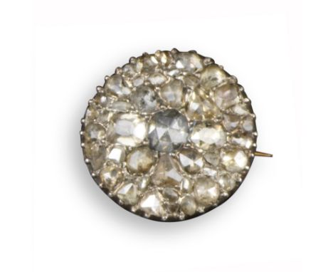 A George III diamond-set circular brooch, pavé-set with rose-cut diamonds in silver on gold, probably converted from a ring, 