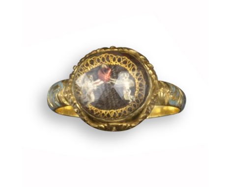 A gold and crystal romantic ring, possibly French, late 17th century, the faceted crystal covers two winged putti, both clasp