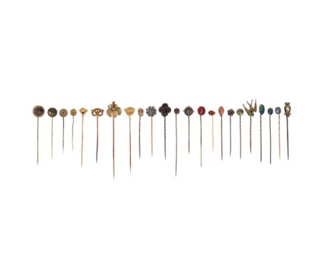 Twenty-three assorted stick pins, of various designs including an owl, a dogs mask and some set with assorted gemstones inclu