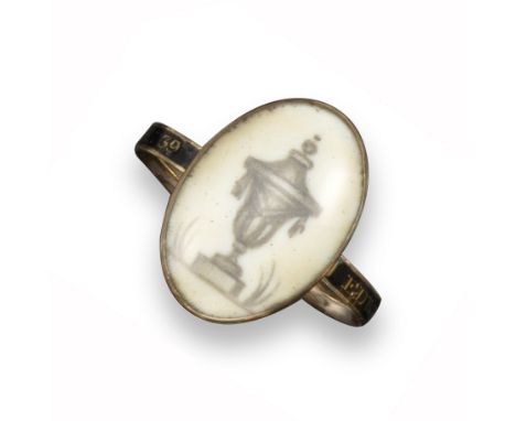 A George III mourning ring, the glazed oval plaque depicting a covered urn painted in sepia, the shank with black enamel deco