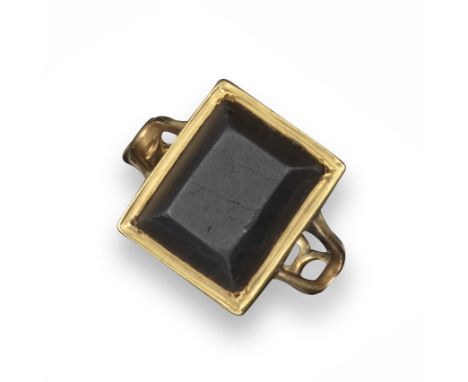 An early Victorian rectangular and faceted stone-set gold ring, c1840, believed to have been a gold-testing touch stone, with