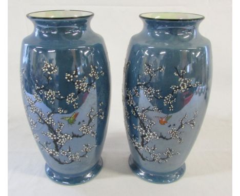 Pair of Carlton ware blue pearl lustre prunus pattern vases with blossom, birds and insects H 27 cm
