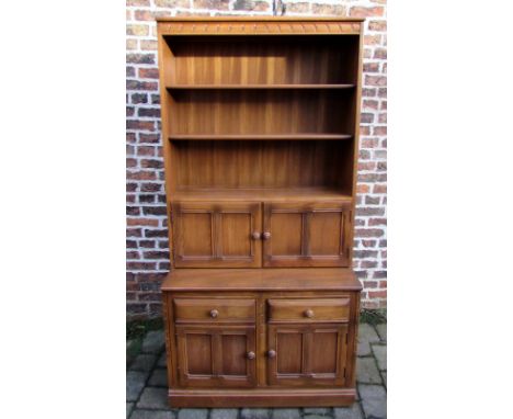 Ercol elm bookcase on cabinet in Golden Dawn finish