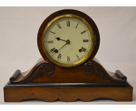 A rosewood and ebony 8 day mantle clock with Roman numerals, ornate scrolled shoulders resting on a rectangular plinth 