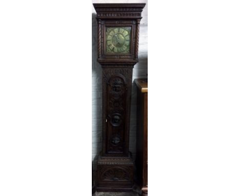 18th century 30 hour longcase clock in a heavily carved oak case with single hand & brass dial engraved Jn Welch Chesham