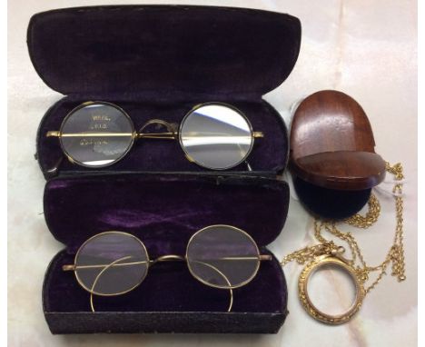 9ct gold monocle on a 9ct gold chain with wooden case & 2 pairs of gold plate spectacles 