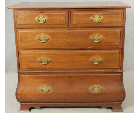 A late 19th century walnut Continental bombe style chest of drawers on shaped bracket feet. H.102 W.107 D.56cm 