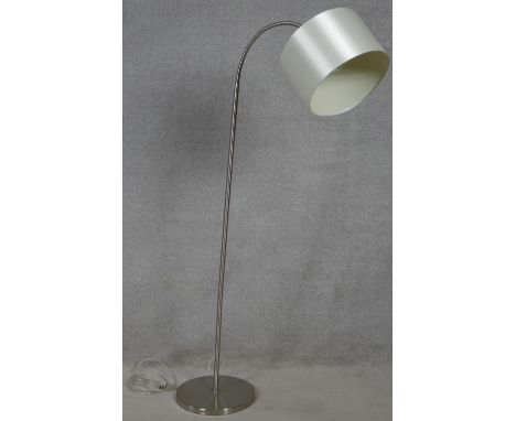 A contemporary standard lamp and shade with flexible adjustable column for use as a reading lamp. H.195cm 