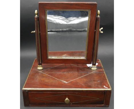 A 19th century French Empire style mahogany swing toilet mirror with brass inlay and fitted with base drawer. H.37 W,32 D.40c