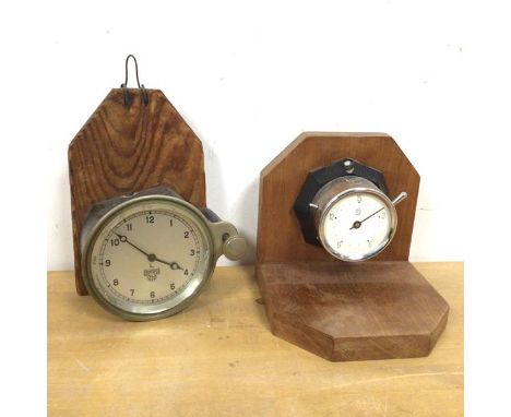 A Smiths automobile clock melted on wall hanging frame, dial measures 8cm along with another clock mounted on book end (2)