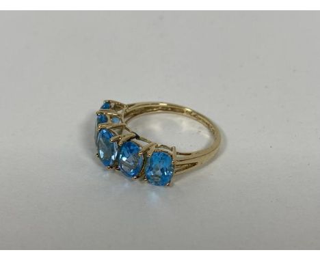 A 9ct gold ring set five oval cut light blue stones (P) (2.75g)