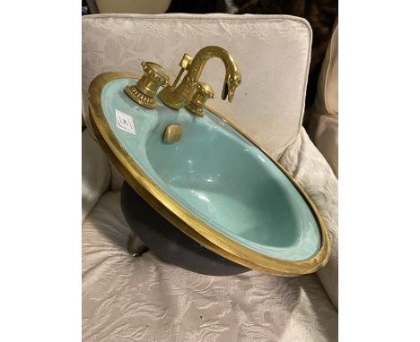 An unusual 1960's/70's bathroom wash basin with capstan style hot and cold taps on enamel basin measures 50x47.5x48cm