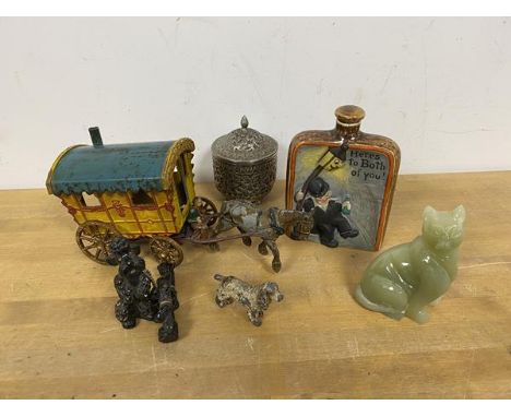 A mixed lot including a cast metal toy, Gypsy Caravan and a figure with horse, a polished stone figure of a Cat, a novelty fl