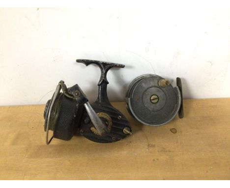 A vintage fishing reel inscribed J E WALKER NEWCASTLE UPON TYNE measures 3 x 7.5, another reel inscribed K P MORRITT'S INTREP