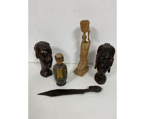 A pair of carved African hardwood busts, one male, one female, another sculpture of a Kneeling Woman with Basket, a letter op