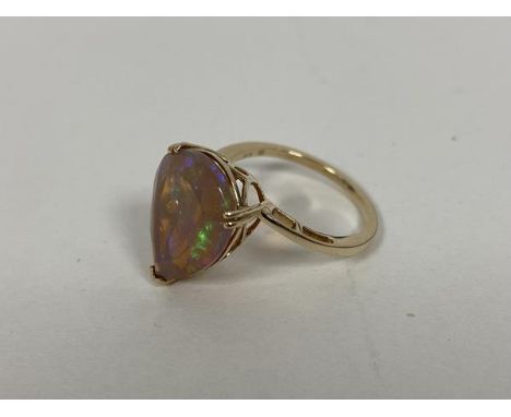 A 9ct gold pear shaped cut opal in pierced setting and shank to shoulders (O) (3.17g)