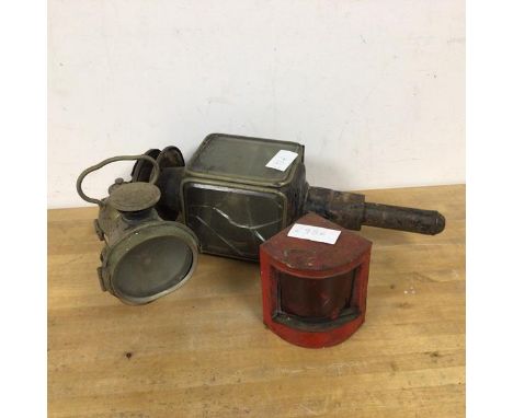 A collection of vintage lamps including an oil burning lamp stamped Lucas, a port running light and a lantern, largest measur