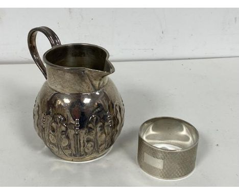 A 19thc London silver milk jug, makers mark JA JS other  marks rubbed, with foliate decoration (8cm) and a 20thc engine turne