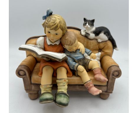 A Goebel of Germany Moments in Time figure titled "Story time" No. 2261. Marked as a limited edition 0655/3000. 