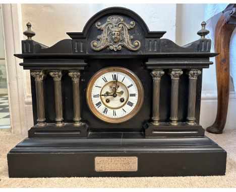 A very heavy black slate and brass 19thC mantle clock with visible brocot movement by JJS, 3 Corinthian columns to either sid