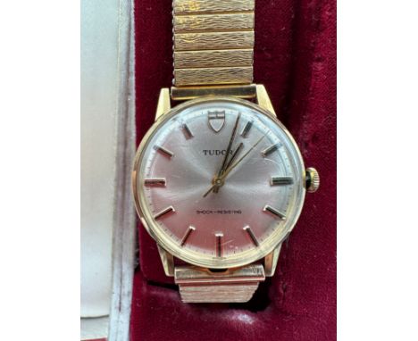 A Tudor 9ct gold gentleman's wristwatch on rolled gold strap. Retirement watch S Powell 24. 8. 42. to 24. 8. 72. In red Tudor