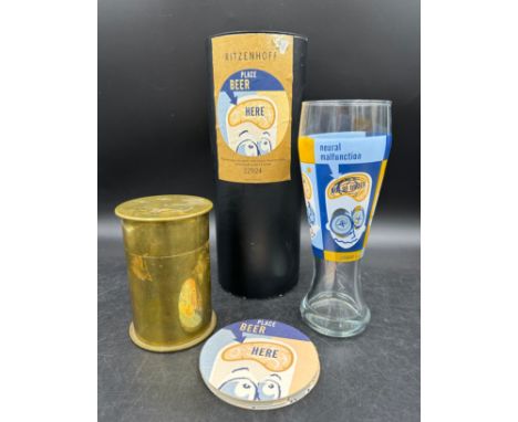 Brass shell case moneybox containing old pennies together with Ritzenhoff boxed beer glass R. Goetz 1998. 