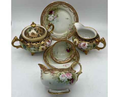 Two Noritake jugs, lidded sucrier and a cup, saucer and plate. 