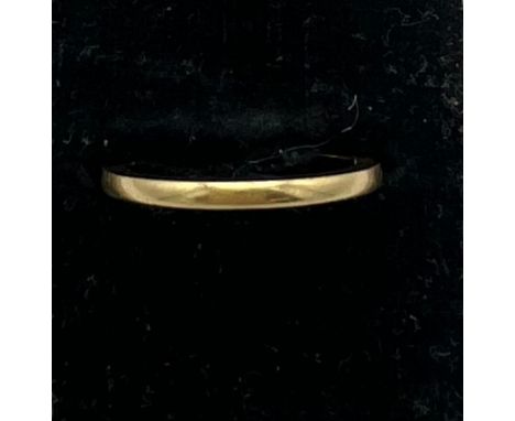 An 18 carat gold wedding band, size K, weight 2.2gm. ‘Fidelity’ inscribed to inside. 