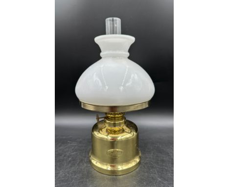 A 20thC oil lamp marked to front E.S Sorensen and to base Scantime Denmark. Height to top of chimney approx. 30cm. Proceeds t