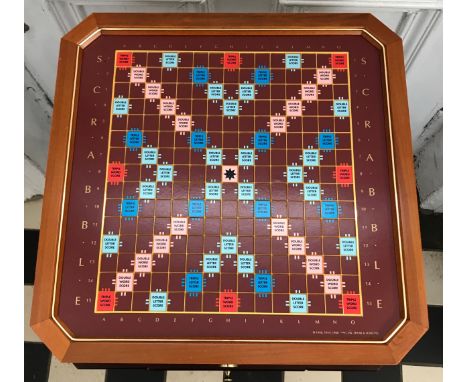 A Franklin Mint Scrabble collectors edition set, with 24k gold plated game pieces, hardwood framed playing board with a raise