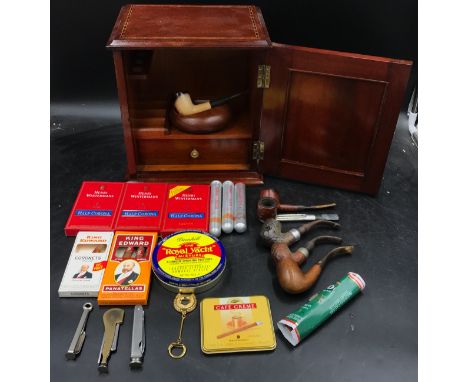 A wooden smokers cabinet with contents to include cigars: 2x Romeo y Julieta, Macanudo Jamaica, 3x boxes of Henri Wintermans 