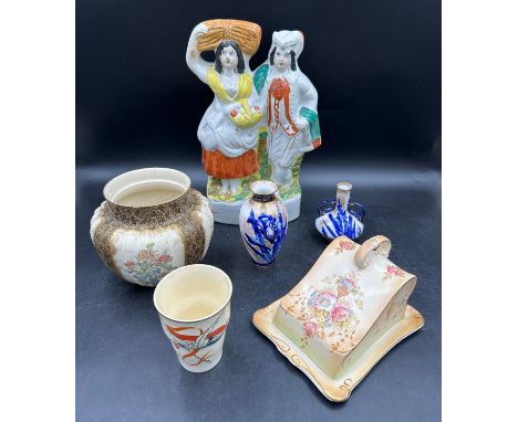 An assortment of ceramics to include a Staffordshire flatback, Doulton Burslem planter, two Royal Doulton iris vases, a Crown
