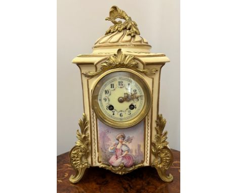 A French porcelain and ormolu mounted mantle clock by Japy Frères with decorative floral and figurative panels and white enam