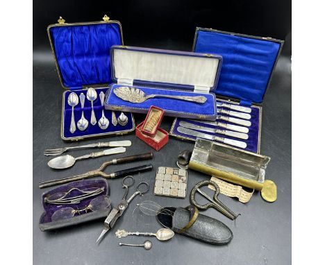 An interesting miscellany to include a rattle of a rattlesnake, 19thC spectacles, candle snuffers, 800 silver spoon, brass to