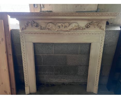 A well carved pine fire surround. Internal 95w x 95cm h, external 157w x 141xm h. By Douglas Brickwood, Specialist Architectu